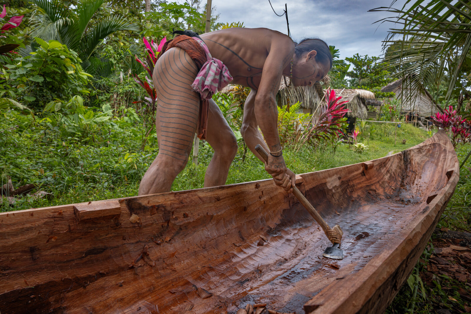 Mentawai shaman making canoe