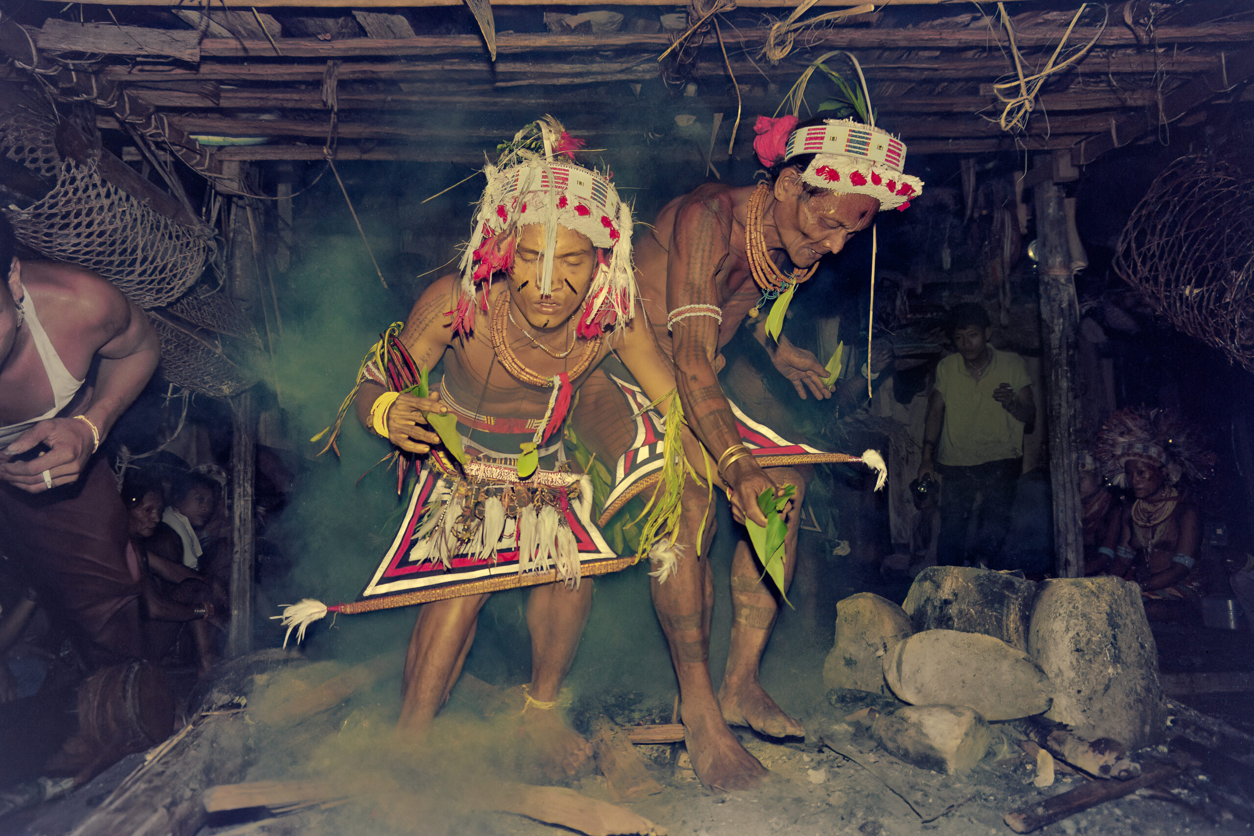 Mentawai novice shaman in fire during lecu ritual on Siberut Island