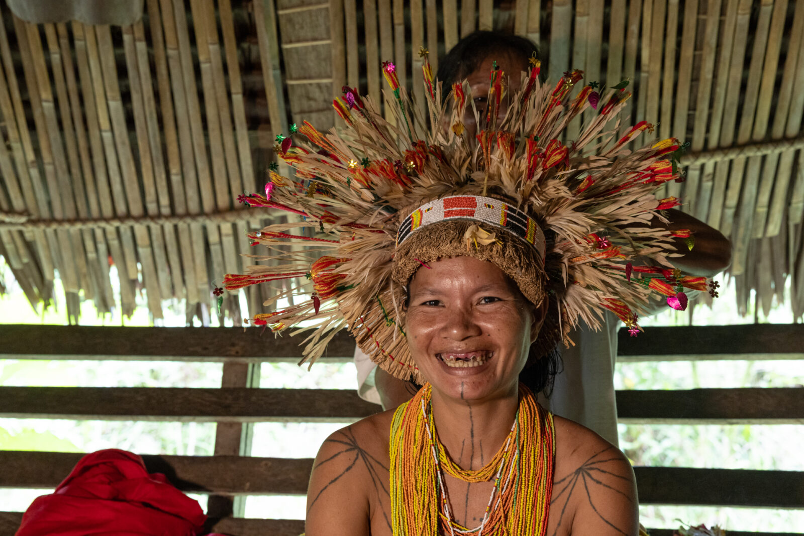 Mentawai woman with teteku head decoration