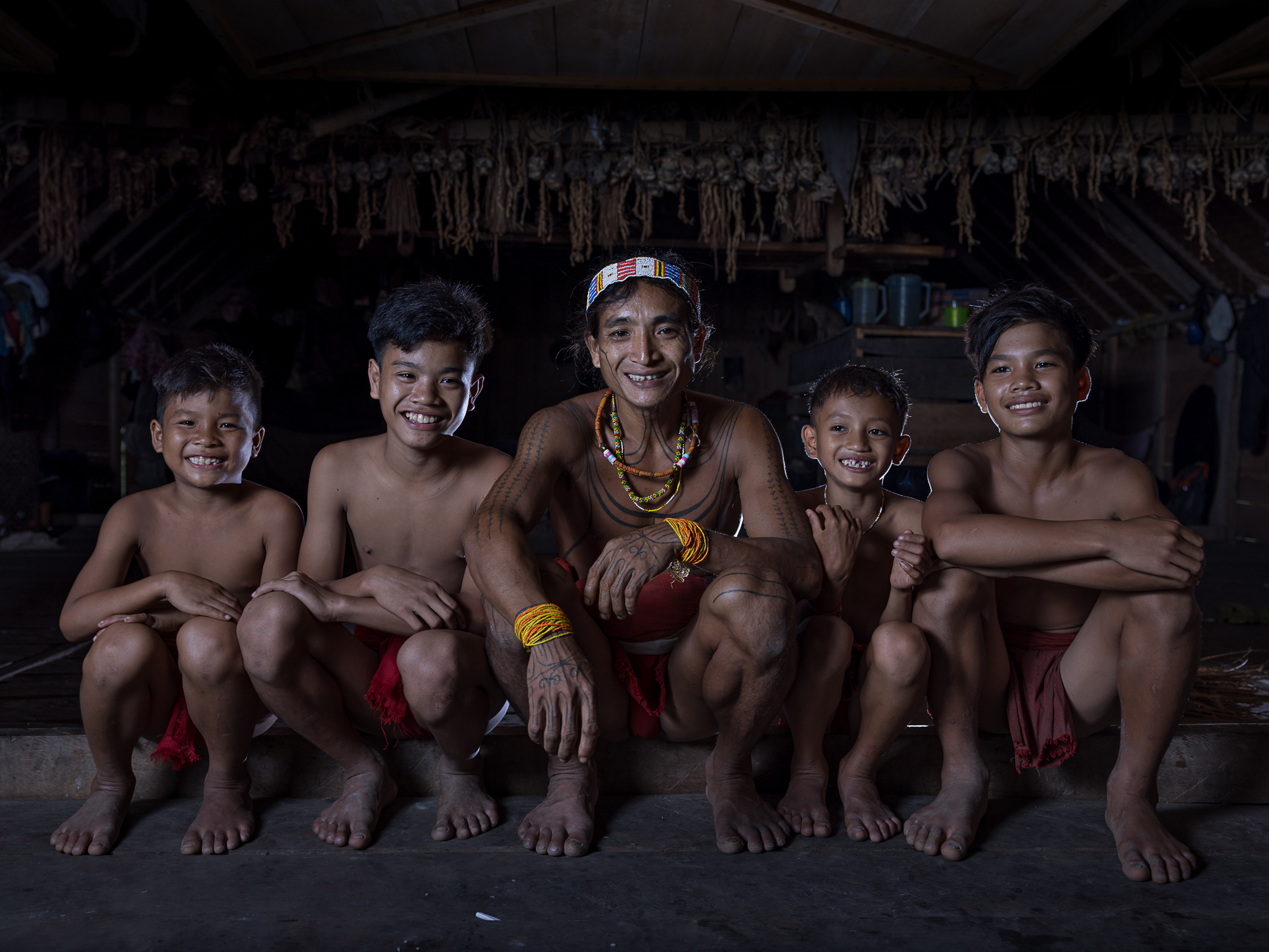 Mentawai shaman with sons on Siberut Island