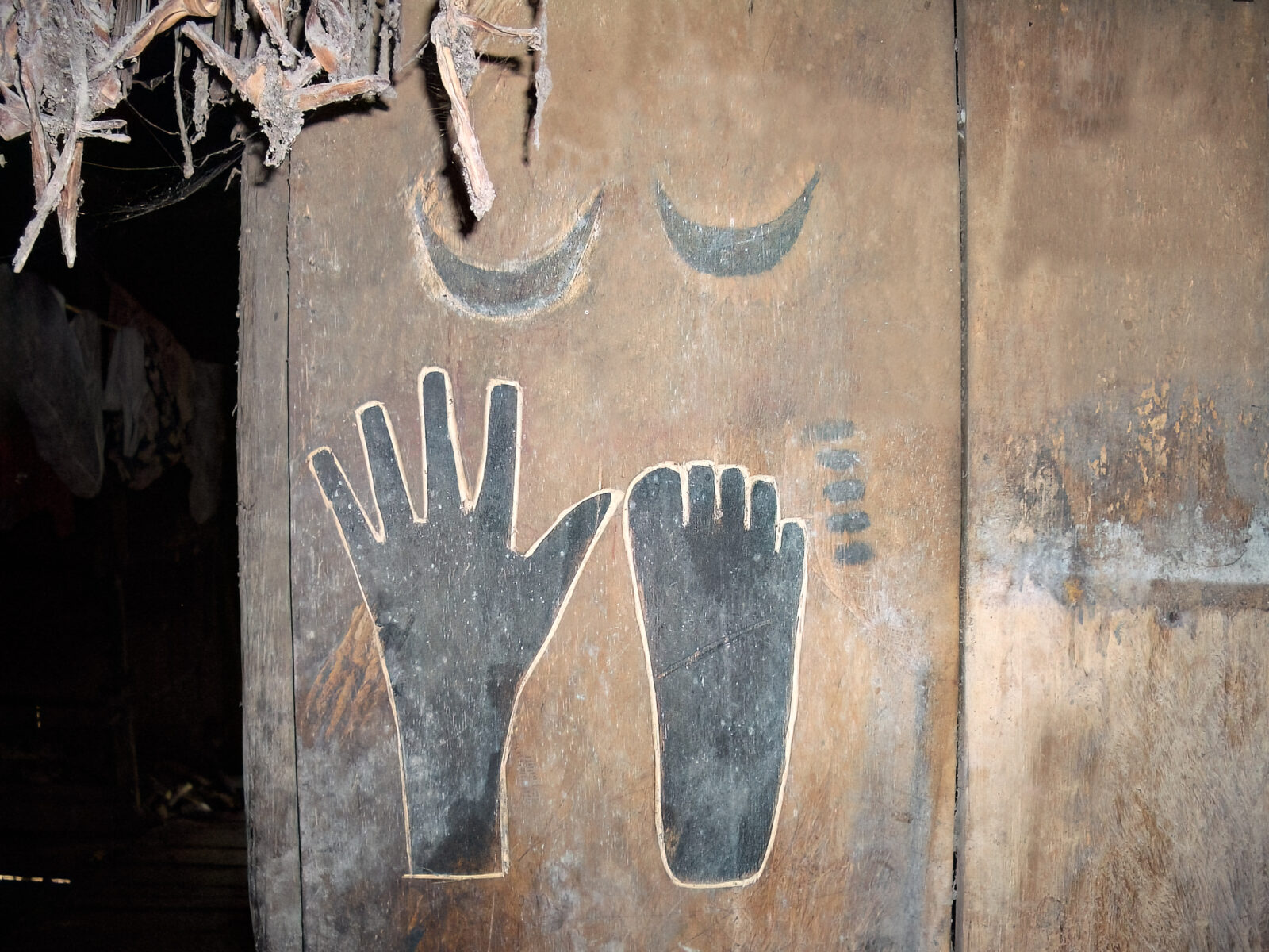 Takep hand and foot carving on wall in Mentawai uma house as death memorial