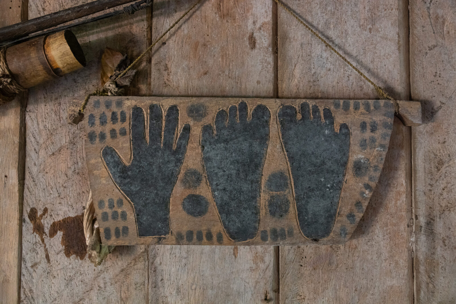 Takep hand and foot carving on plank in Mentawai uma house as death memorial