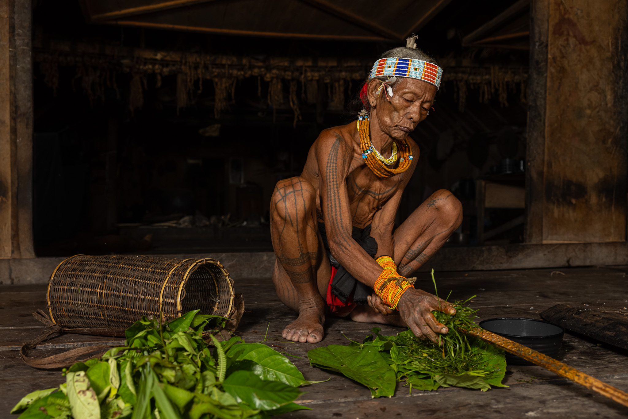Mentawai shaman on Siberut Island making herbal medicine