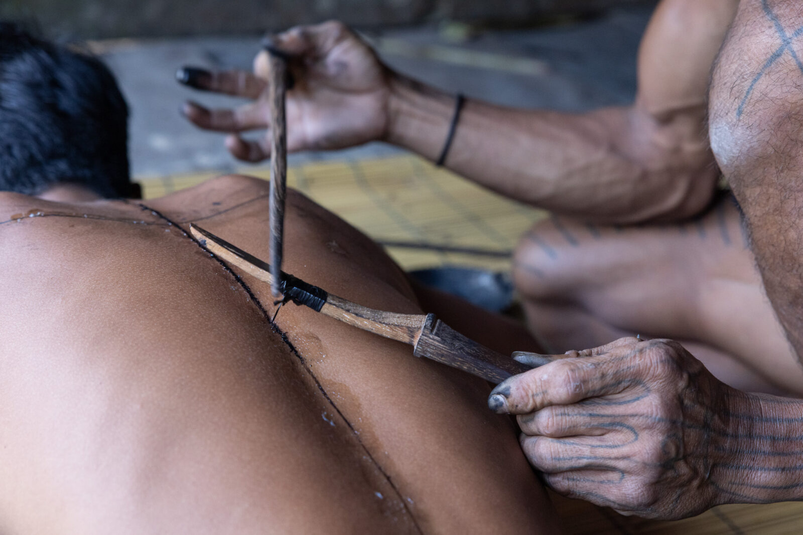 Mentawai hand-tapping tattoo