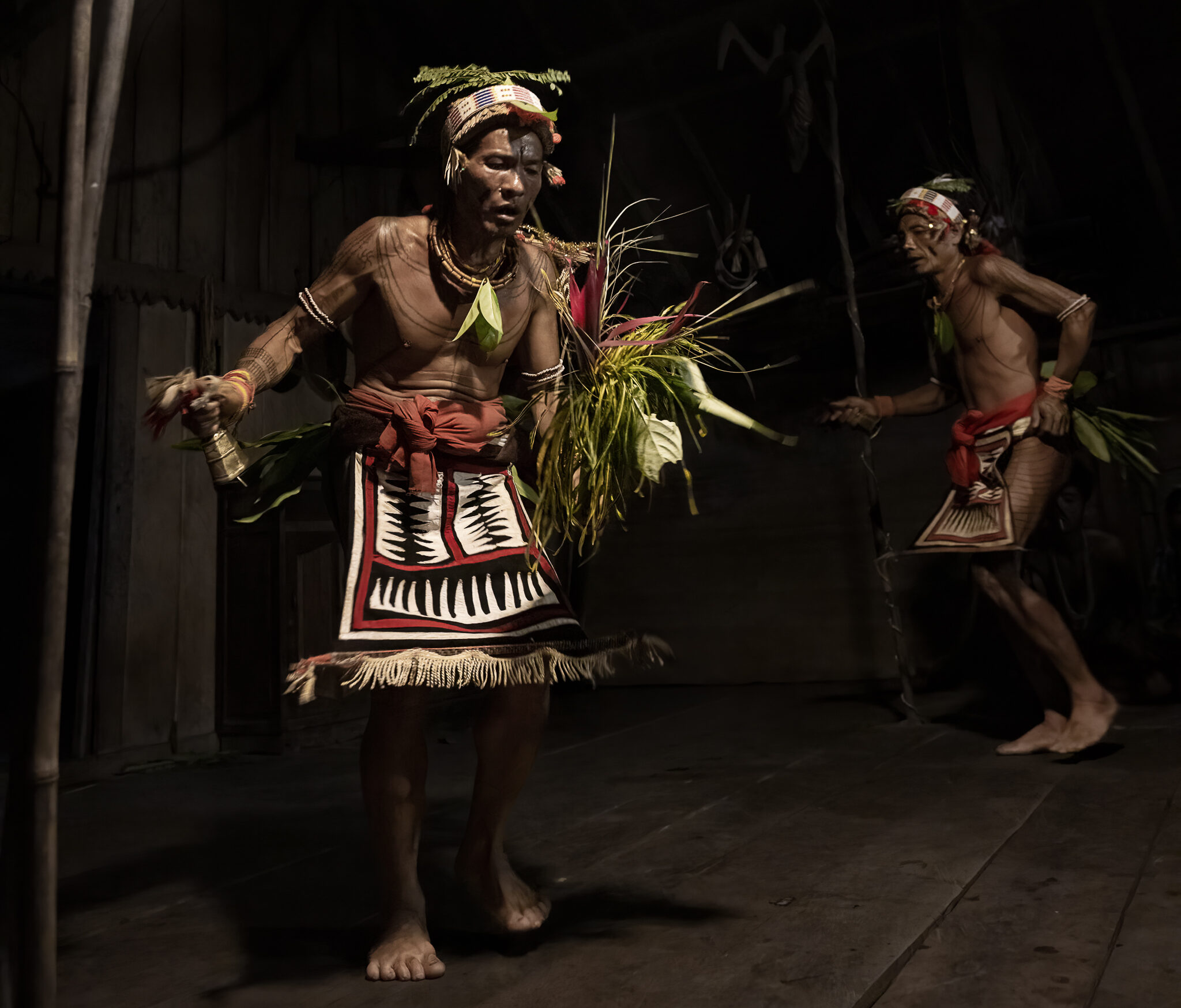 Mentawai shamans on Siberut dancing lajo during a ritual