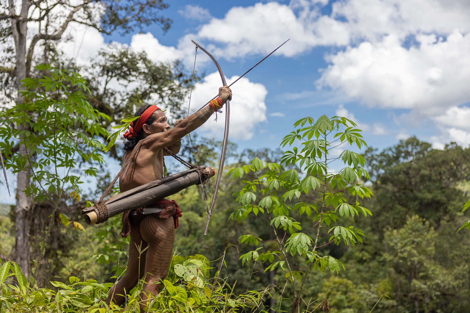 Mentawai shaman hunting with bow and arrows on Siberut Island