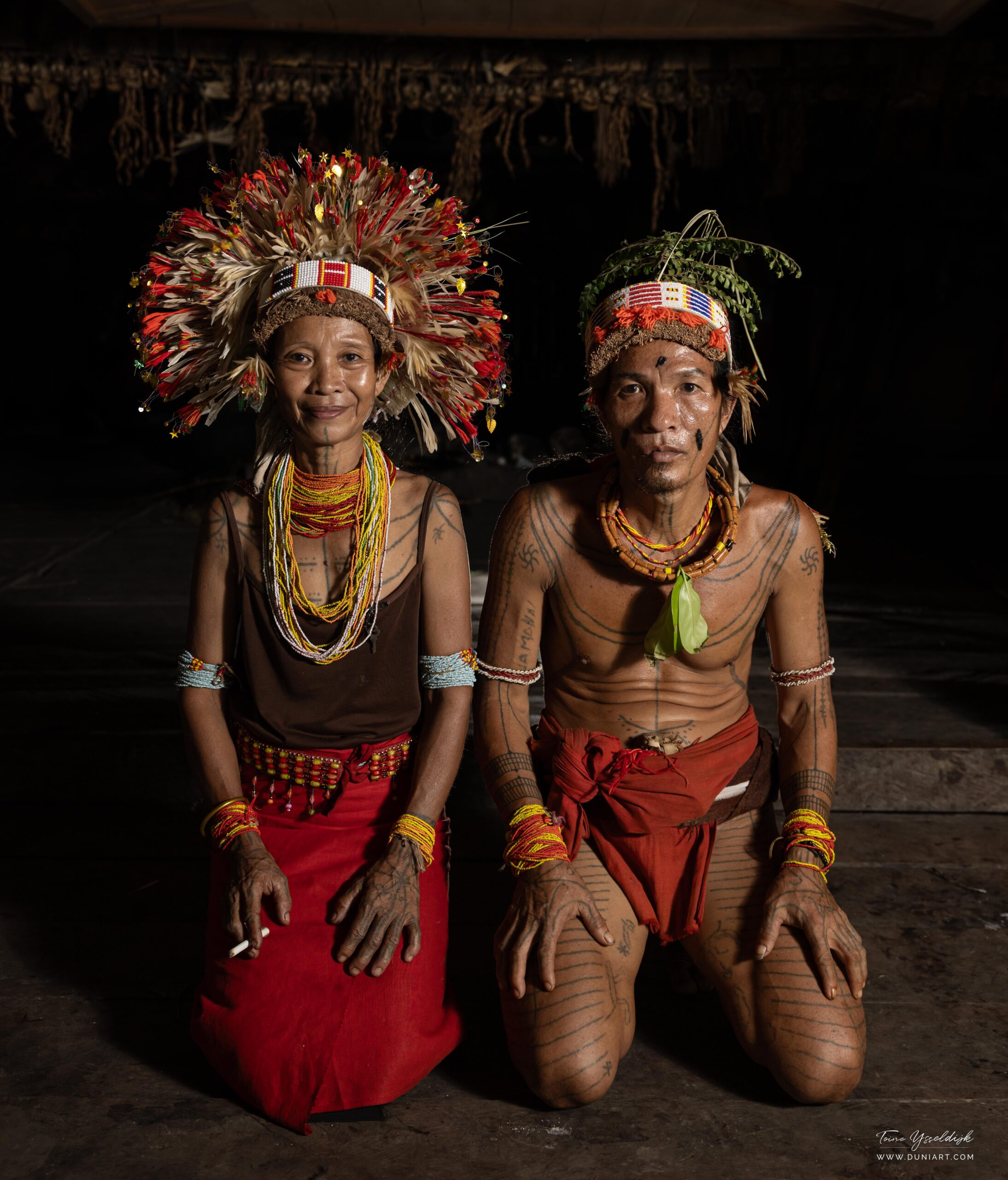 Mentawai shaman couple on Siberut Island, in full ceremonial attire
